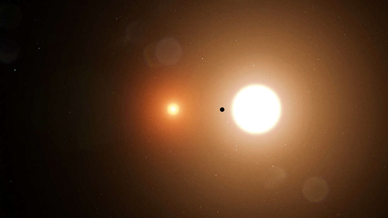 artists impression of TOI 1338 B silhouetted against its host stars